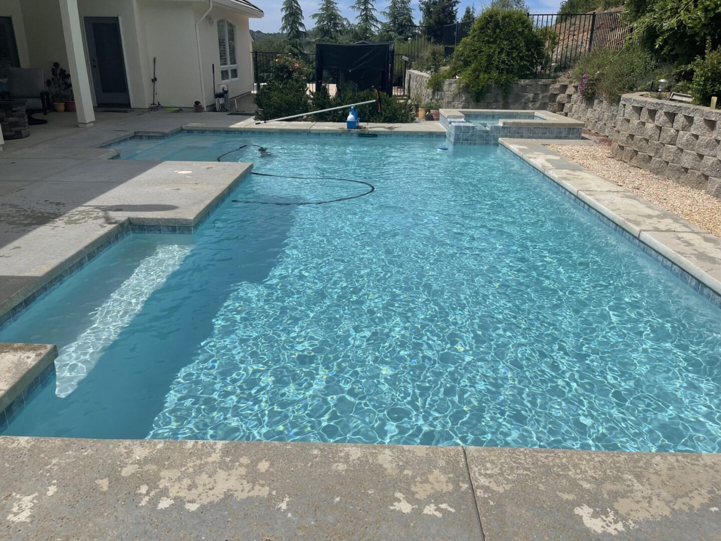 A swimming pool with a kiddie pool