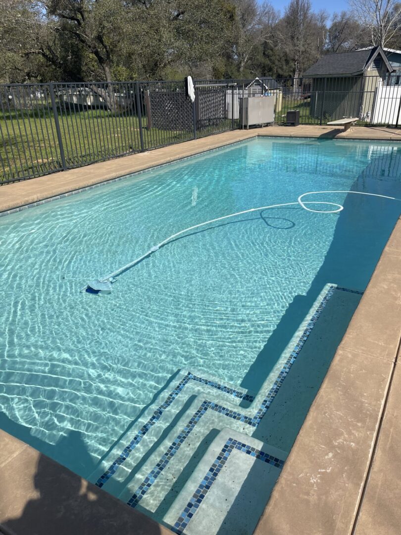 A rectangle swimming pool being filled